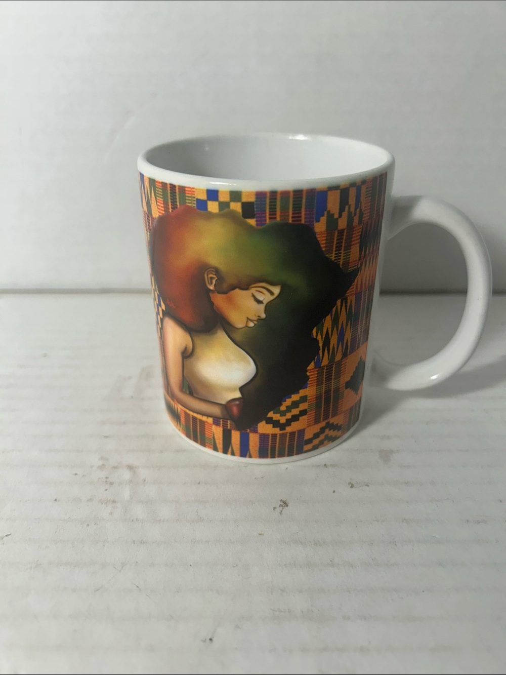 White Ceramic Mug with Multicolor Afro-Art Design